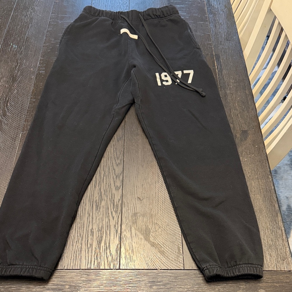 Fear of God Black Joggers with White "1977" Graphic